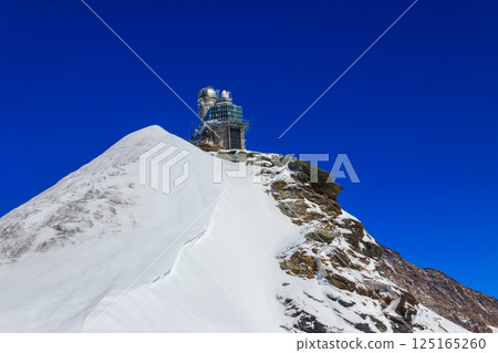 View of Sphinx Observatory on Jungfraujoch, one of the highest observatories in the world located at the Jungfrau railway station, Bernese Oberland, Switzerland View of Sphinx Observatory on Jungfraujoch, one of the highest observatories in the world located at the Jungfrau railway station, Bernese Oberland, Switzerland 125165260
