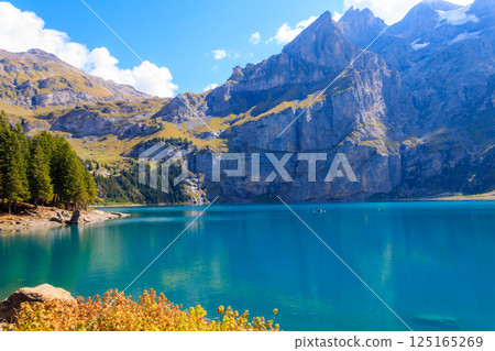 View of Oeschinen lake (Oeschinensee) and Swiss Alps near Kandersteg in Bernese Oberland, Switzerland 125165269