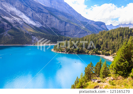 View of Oeschinen lake (Oeschinensee) and Swiss Alps near Kandersteg in Bernese Oberland, Switzerland View of Oeschinen lake (Oeschinensee) and Swiss Alps near Kandersteg in Bernese Oberland, Switzerland 125165270