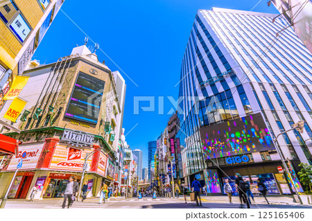 Tokyo cityscape in April, Japan. Overlooking the bustling shopping district in front of Ikebukuro Station on the 16th 125165406