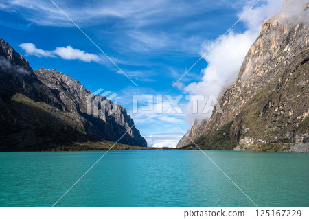 Turquoise lake surrounded by mountains on the Laguna 69 trek, Peru 125167229
