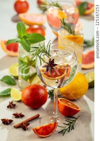 Refreshing summer cocktails with citrus on a white marble table. Refreshing summer cocktails with citrus on a white marble table. 125167253