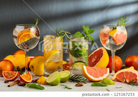 Refreshing summer drinks with ingredients on a white marble table. Refreshing summer drinks with ingredients on a white marble table. 125167255