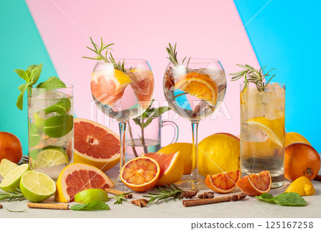 Refreshing summer cocktails with ingredients on a bright colorful background. Refreshing summer cocktails with ingredients on a bright colorful background. 125167258