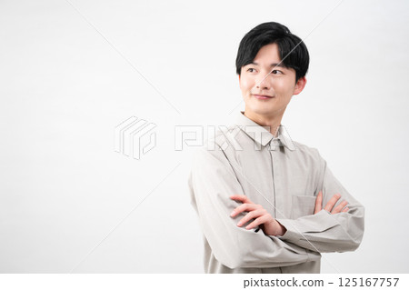 Young man wearing a long-sleeved shirt Lifestyle image 125167757