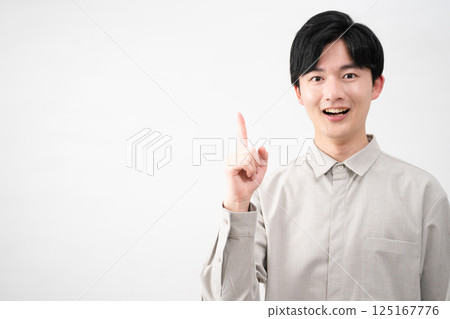 Young man wearing a long-sleeved shirt Lifestyle image Young man wearing a long-sleeved shirt Lifestyle image 125167776