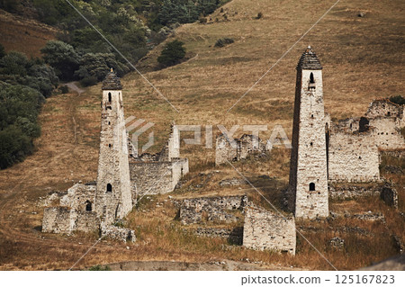 High stone towers in the Caucasus, medieval castle and town in the mountains, close-up 125167823
