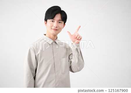 Young man wearing a long-sleeved shirt Lifestyle image 125167900