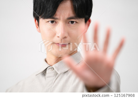 Young man wearing a long-sleeved shirt Lifestyle image Young man wearing a long-sleeved shirt Lifestyle image 125167908