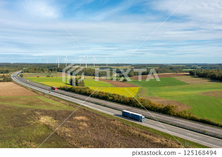 Highway and wind turbines in nature, drone aerial view in autumn 125168494