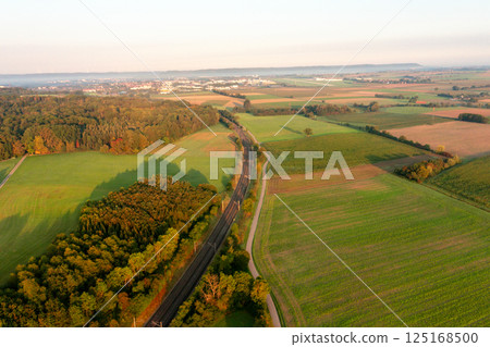 Railtracks passing through nature, drone aerial view at sunrise 125168500