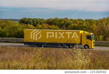Truck driving on the highway in autumn scenery in Germany. Truck driving on the highway in autumn scenery in Germany. 125168502