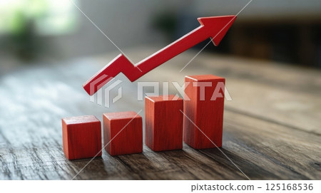 Red arrow increasing over wooden cubes showing market growth Red arrow increasing over wooden cubes showing market growth 125168536