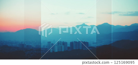 Urban landscape intertwines with majestic mountains in a captivating visual blend. Urban landscape intertwines with majestic mountains in a captivating visual blend. 125169095