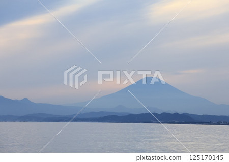 A view of Mt. Fuji turning blue after sunset from the west promenade of Katase Fishing Port 125170145