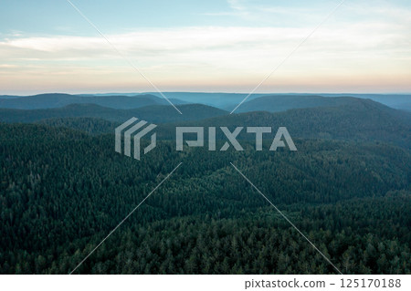 Black Forest drone aerial view, horizon over mountains in the evening Black Forest drone aerial view, horizon over mountains in the evening 125170188
