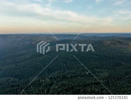 Drone aerial view in the evening with horizon over Black Forest mountains Drone aerial view in the evening with horizon over Black Forest mountains 125170191