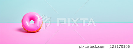 A vibrant banner featuring a colorful donut with pink frosting, topped with sprinkles, set against a clean blue background. The donut, round and inviting, showcases the sweetness of dessert 125170306
