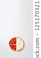 four different pieces of pizza on a white background, showcasing a variety of flavors. The slices include cheese, pepperoni, dorblue, blue cheese, and feta, each with distinct toppings and textures 125170321