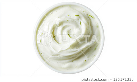 Creamy corn and leek soup garnished with fresh herbs. 125171333