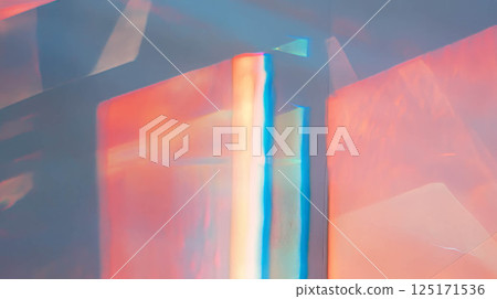 Vibrant prismatic texture of blue and red wall with rainbow light effects. 125171536