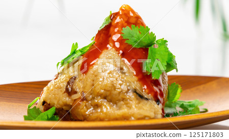 Delicious rice dumplings with sauce and coriander 125171803