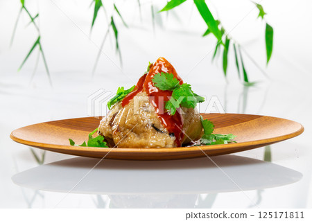 Delicious rice dumplings with sauce and coriander Delicious rice dumplings with sauce and coriander 125171811