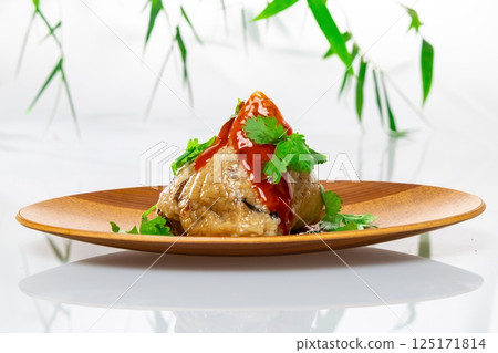 Delicious rice dumplings with sauce and coriander 125171814