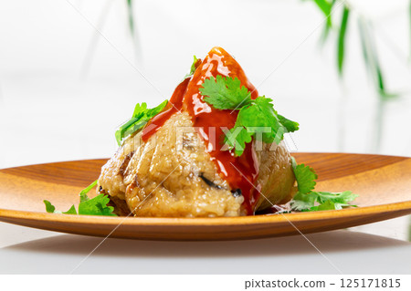 Delicious rice dumplings with sauce and coriander 125171815
