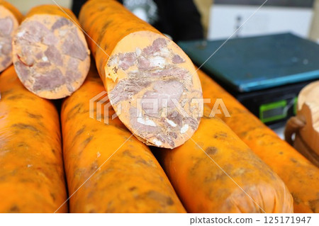 On display are fresh sweet potatoes featuring a creamy purple interior, sure to impress anyone 125171947