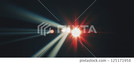 Dark film background features bright highlights and a central focus, enhancing visual depth. 125171958