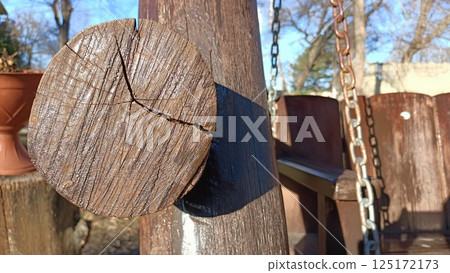 Wooden Swing Set Support with Chain against a Beautiful Natural Background Setting Wooden Swing Set Support with Chain against a Beautiful Natural Background Setting 125172173