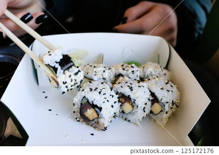Enjoy delicious sushi rolls with nutritious black sesame seeds, delightful and appealing Enjoy delicious sushi rolls with nutritious black sesame seeds, delightful and appealing 125172176