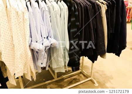 A Wide Variety of Stylish and Fashionable Shirts on Display in the Retail Store Today 125172179