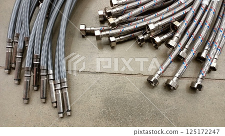 A versatile collection of flexible plumbing hoses with durable metal connectors for many uses A versatile collection of flexible plumbing hoses with durable metal connectors for many uses 125172247