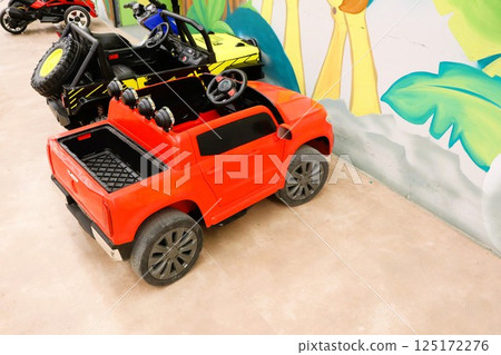 A Vibrant Array of Colorful Toy Cars Displayed in a Fun and Engaging Play Area for Kids 125172276
