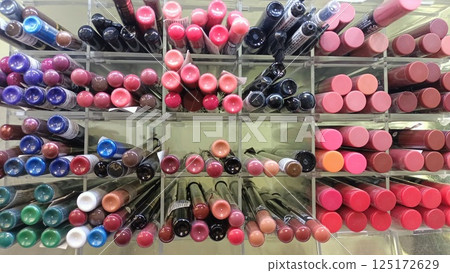 A visually appealing and vibrant display of colorful lipstick products for cosmetic enthusiasts 125172629