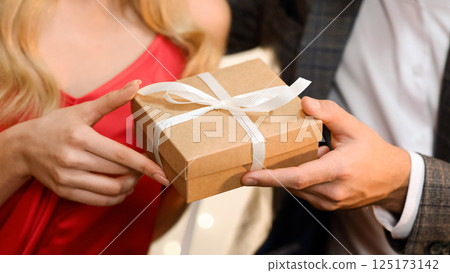 Gift For You. Closeup Of Unrecognizable Man Giving Present Box To His Beloved Woman, Greeting With Valentines Day Or Anniversary, Crop 125173142
