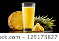 Fresh pineapple juice in a tall glass on a dark background 125173827