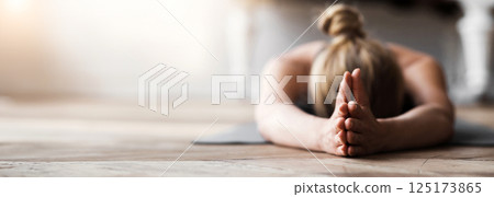 Yoga for mind. Young woman laying face down on yoga mat at studio, meditating Yoga for mind. Young woman laying face down on yoga mat at studio, meditating 125173865