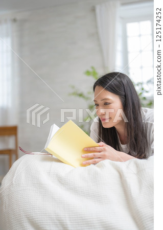 Beautiful woman reading in bed | Study | Hobby | Healthy living image | Well-being girl | Well-being Beautiful woman reading in bed | Study | Hobby | Healthy living image | Well-being girl | Well-being 125174252