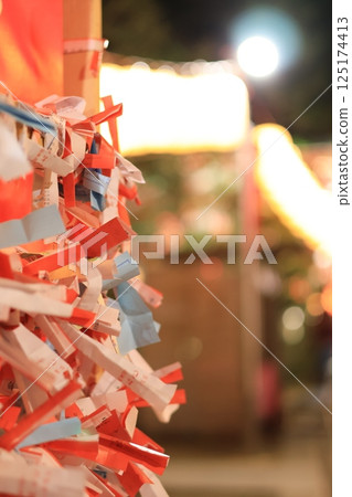 A close-up of fortune slips tied in the grounds of Enoshima Shrine A close-up of fortune slips tied in the grounds of Enoshima Shrine 125174413