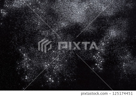 Abstract background. Wheat flour spots on black. Top view on blackboard. Baking concept, cooking dough or pastry. 125174451