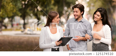 Sociological Survey. Woman Interviewing Couple Conducting Opinion Poll Walking In City Outdoor. 125174510