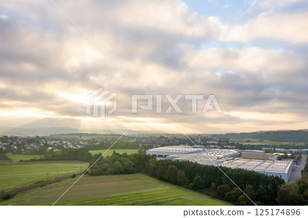 Factory and warehouse at sunrise in a village in Baden Wurttemberg region, Germany 125174896