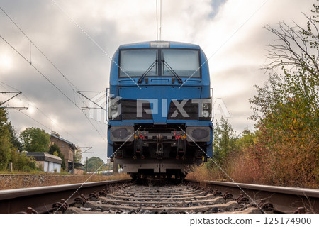 Front view of electric locomotive transporting fuel storage tanks 125174900