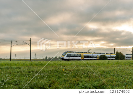 Sunrise landscape with a passenger train traveling in Baden Wurttemberg,  Germany 125174902