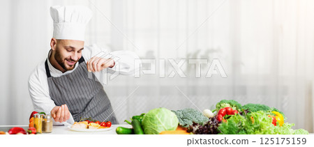 Cooking Fish. Male Chef Seasoning Roasted Salmon Steak Standing In Kitchen. Selective Focus 125175159