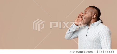 Hello. Mature african man shouting aside at free space, orange panorama background Hello. Mature african man shouting aside at free space, orange panorama background 125175333