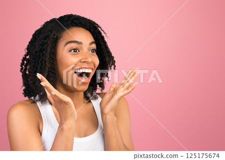 Big Sale Concept. Panorama of surprised african woman staring at copy space over isolated white studio background Big Sale Concept. Panorama of surprised african woman staring at copy space over isolated white studio background 125175674
